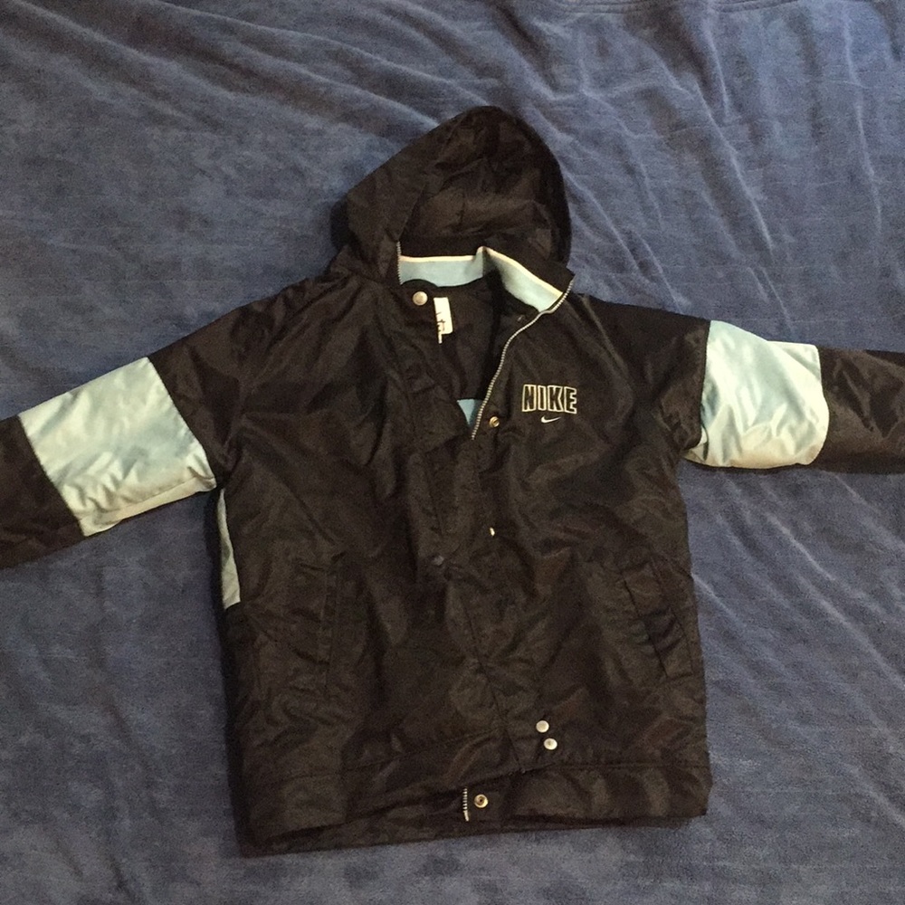 Light blue and black Nike puffer jacket.